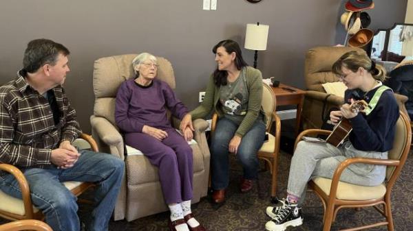 November 2022: Andrea; her husband, Jay; and their daughter, Alicia; enjoy what would be their final time playing and singing with Andrea’s Mom.  A wo<em></em>nderful visit the Saturday after Thanksgiving.