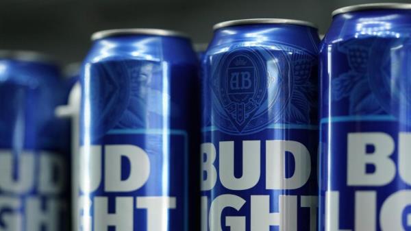 FILE - Cans of Bud Light beer are seen before a ba<em></em>seball game between the Philadelphia Phillies and the Seattle Mariners on April 25, 2023, in Philadelphia. The country's largest advocacy group for LGBTQ+ rights has suspended its benchmark equality and inclusion rating for Anheuser-Busch, citing the beer company's handling of hate-filled and transphobic backlash received after its partnership with transgender influencer Dylan Mulvaney in April. (AP Photo/Matt Slocum, File)