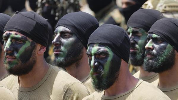 Fighters from the Lebanese militant group Hezbollah carry out a training exercise in Aaramta village in the Jezzine District, southern Lebanon, Sunday, May 21, 2023. The show of force came ahead of 