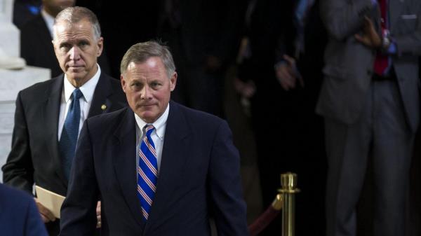 Staff in the offices of North Carolina Senators Thom Tillis (left) and Richard Burr were among those threatened by an American living in Thailand, the FBI says.