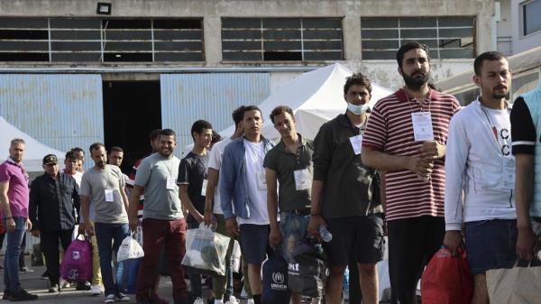 Survivors of latest tragical shipwreck prepare to board a bus to transfer to Athens at the port of Kalamata, Greece, Friday, June 16, 2023. The round-the-clock effort co<em></em>ntinued off the coast of southern Greece despite little hope of finding survivors or bodies after none have been found since Wednesday, when 78 bodies were recovered and 104 people were rescued. (John Liakos/InTime News via AP)