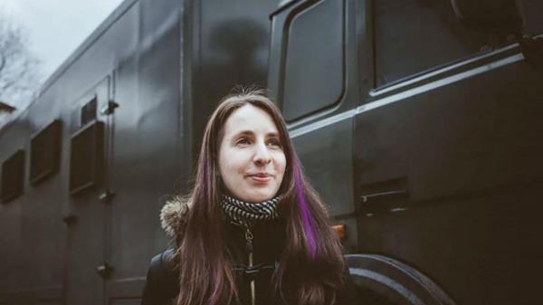 This undated handout photo released by the Viasna Human Rights Centre shows human rights activist Nasta Loika standing next to a police van in Minsk, Belarus. The Minsk City Court co<em></em>nvicted Nasta Loika, 34, on charges of 