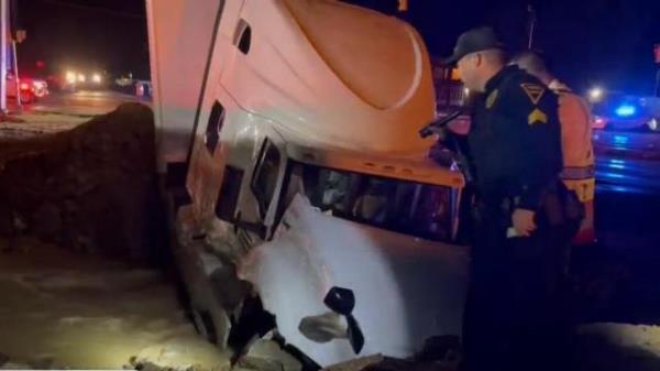 Tractor-trailer crashes into sinkhole on US-401 in Fayetteville