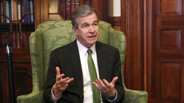 FILE - Democratic North Carolina Gov. Roy Cooper speaks to The Associated Press in a year-end interview at the Executive Mansion in Raleigh, N.C., Dec. 14, 2022. On Friday, June 16, 2023, Cooper vetoed GOP legislation that would ban the promotion of certain beliefs that some lawmakers have likened to critical race theory in state government workplaces. (AP Photo/Hannah Schoenbaum, File)