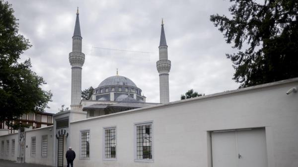 A man is on his way into the Sehitlik Mosque in Berlin, Germany, Thursday, June 29, 2023. Racism, hatred and sometimes violence against Muslims in Germany are widespread and often part of their everyday experience, says a new report that was presented at the interior ministry in Berlin on Thursday. It co<em></em>ncludes that at least one third of Muslims in Germany have experienced hostility due to their religion. (AP Photo/Markus Schreiber)