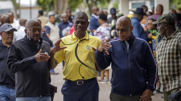 FILE — Then former African Natio<em></em>nal Co<em></em>ngress (ANC) treasurer general and now South African Deputy President, Paul Mashatile, center, walks out following a meeting of the ANC's natio<em></em>nal executive committee, in Johannesburg, South Africa, Friday Dec. 2, 2022. Mashatile's office said Tuesday, July 4, 2023 that a video showing armed police assaulting a man on a freeway until he lay motio<em></em>nless were part of the security team protecting Mashaile. There are no indications that Mashatile was present during the incident. (AP Photo/Jerome Delay, File)