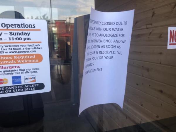 Boil water advisory sign outside Popeyes