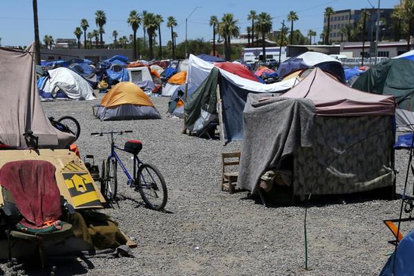 FILE - A large homeless encampment is shown in Phoenix, on Aug. 5, 2020. The city of Phoenix is scheduled go to court Monday, July 10, 2023, to prove it has met a deadline to clear a large homeless encampment, an action that has drawn pushback from civil rights advocates. (AP Photo/Ross D. Franklin, File)