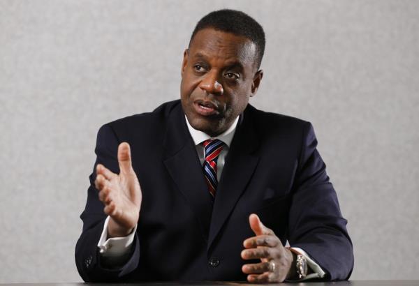 FILE - Detroit emergency manager Kevyn Orr speaks during an interview with The Associated Press in Detroit, Thursday, Dec. 12, 2013. The architect of Detroit's bankruptcy filing admits it was a miserable process. But 10 years on, Detroit's former emergency manager, Orr, maintains the restructuring of the Motor City is among his most im<em></em>portant accomplishments. On July 18, 2013, Detroit became the largest city in the U.S. to file for bankruptcy. (AP Photo/Paul Sancya, File)