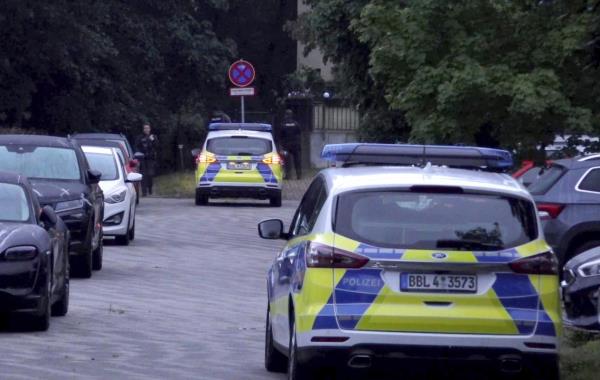 Police patrol during a search operation for a dangerous wild animal near the village of Kleinmachnow in the southern suburbs of Berlin, Germany, Thursday, July 20, 2023. German authorities warned people in Berlin's southern suburbs on Thursday to watch out for a potentially dangerous animal, suspected to be a lioness, that was on the loose. (Sven Kaeuler/TNN/dpa via AP)