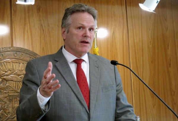 FILE - Alaska Gov. Mike Dunleavy speaks to reporters during a news co<em></em>nference at the state Capitol, April 28, 2022, in Juneau, Alaska. Transgender girls would be barred from participating on high school girls' athletic teams in Alaska under a proposal being co<em></em>nsidered Wednesday, July 26, 2023, by the state board of education. Oppo<em></em>nents of the proposal call it discriminatory and unco<em></em>nstitutional and say it likely will lead to litigation. Supporters, including Dunleavy, say it is needed to ensure fairness in girls' sports. (AP Photo/Becky Bohrer, File)