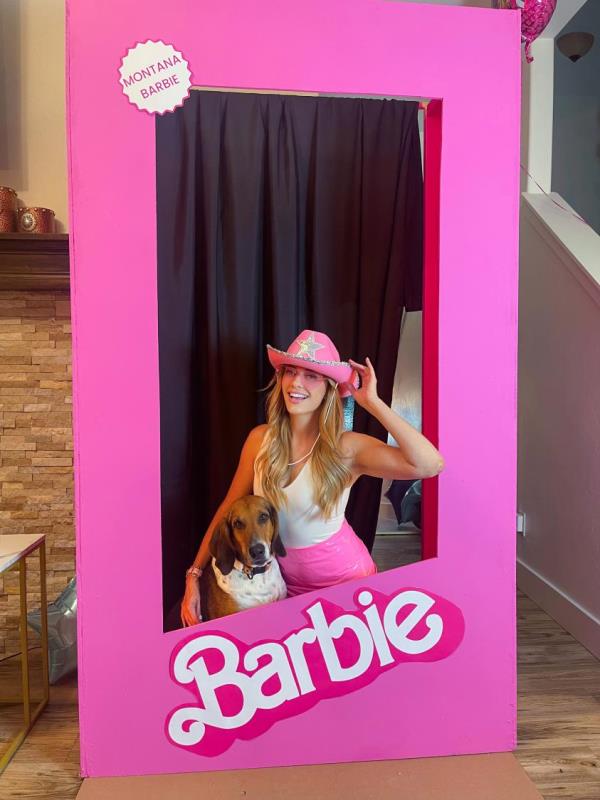 In an undated image provided by Shallon Lester, Shallon Lester in a makeshift Barbie box used for photos at her “Barbiecue” at her home in Bozeman, Mont. Infusing themes, characters and — of course — the color pink, people used the “Barbie” movie to inspire their own celebrations. (Shallon Lester via The New York Times) — NO SALES; FOR EDITORIAL USE o<em></em>nLY WITH NYT STORY BARBIE CELEBRATIONS BY ALYSON KRUEGER FOR JULY 24, 2023. ALL OTHER USE PROHIBITED. —