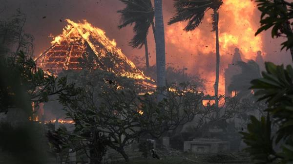 The hall of historic Waiola Church in Lahaina and nearby Lahaina Ho<em></em>ngwanji Mission are engulfed in flames along Wainee Street on Tuesday, Aug. 8, 2023, in Lahaina, Hawaii. (Matthew Thayer/The Maui News via AP)