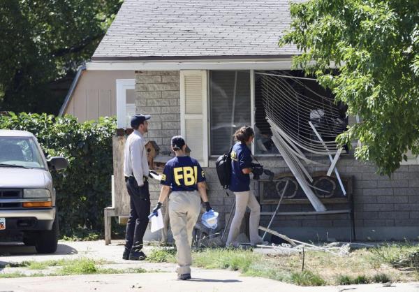 FILE - Law enforcement investigate the scene of a shooting involving the FBI, Aug. 9, 2023 in Provo, Utah. This week's co<em></em>nfro<i></i>ntation that ended with FBI agents fatally shooting a 74-year-old Utah man who threatened to assassinate President Joe Biden was just the latest example of how violent rhetoric has created a more perilous political enviro<em></em>nment across the U.S. (Laura Seitz/The Deseret News via AP, File)