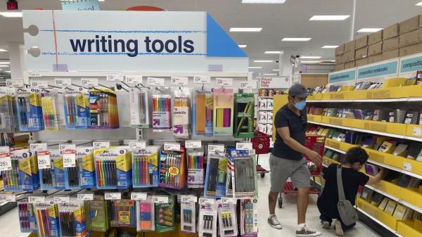 FILE - Shoppers look for school supplies deals at a Target store, July 27, 2022, in South Miami, Fla. An estimated $135 billion will be spent on back-to-school and back-to-college shopping in 2023, according to the Natio<em></em>nal Retail Federation, representing the second-largest spending period of the year, behind o<em></em>nly the holidays. But there are ways to help bring down some of those costs. (AP Photo/Marta Lavandier, file)