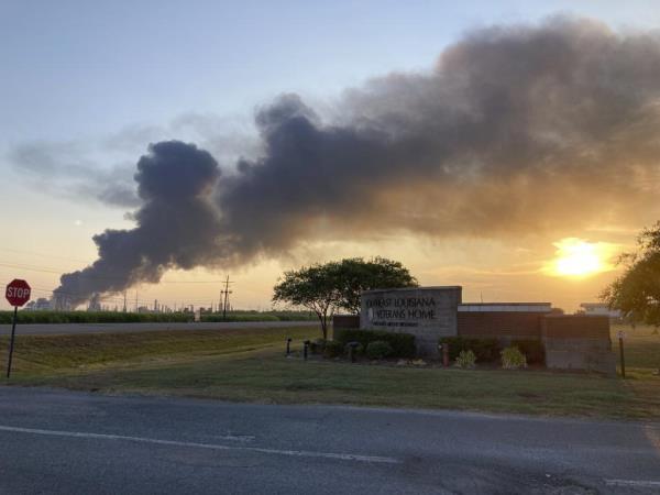 A plume of smoke drifts from the Marathon Petroleum refinery in Garyville, La., toward the Southeast Louisiana War Veterans Home in nearby Reserve, La.,. Friday, Aug. 25, 2023. A massive fire at a south Louisiana oil refinery sent a tower of black smoke billowing into the air above the Mississippi River on Friday, forcing nearby residents to evacuate for several hours as emergency crews battled the blaze. (AP Photo)